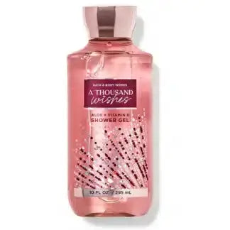 Bath & Body Works Radiant Wishes Shower Gel 295ml — festive golden citrus-floral scent with aloe vera and vitamin E